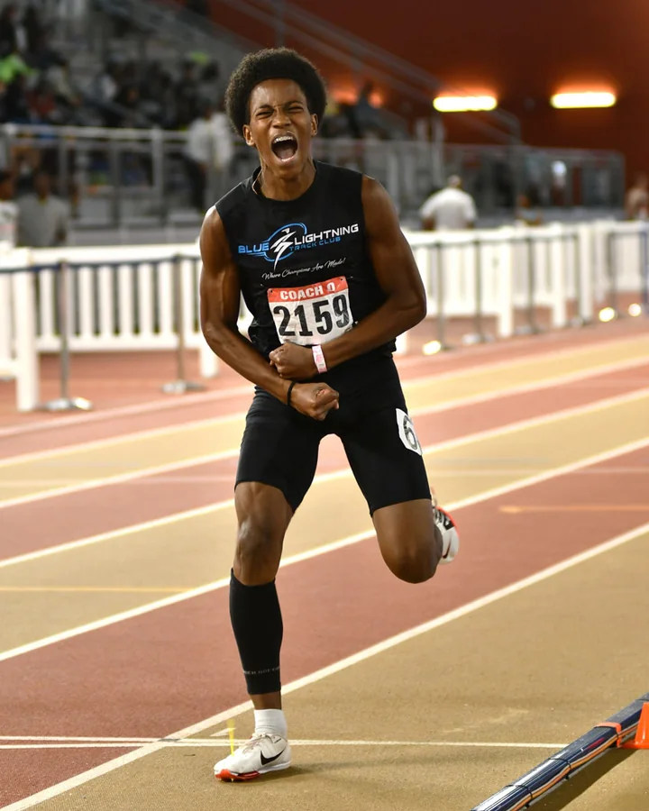 Blue Lightning Champion Cole Strother celebrating after a 400 meter race